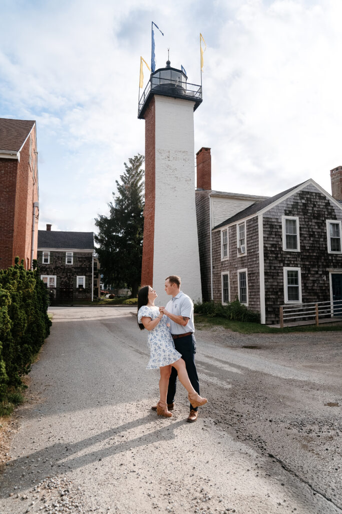 Couple outside of a lighthouse 