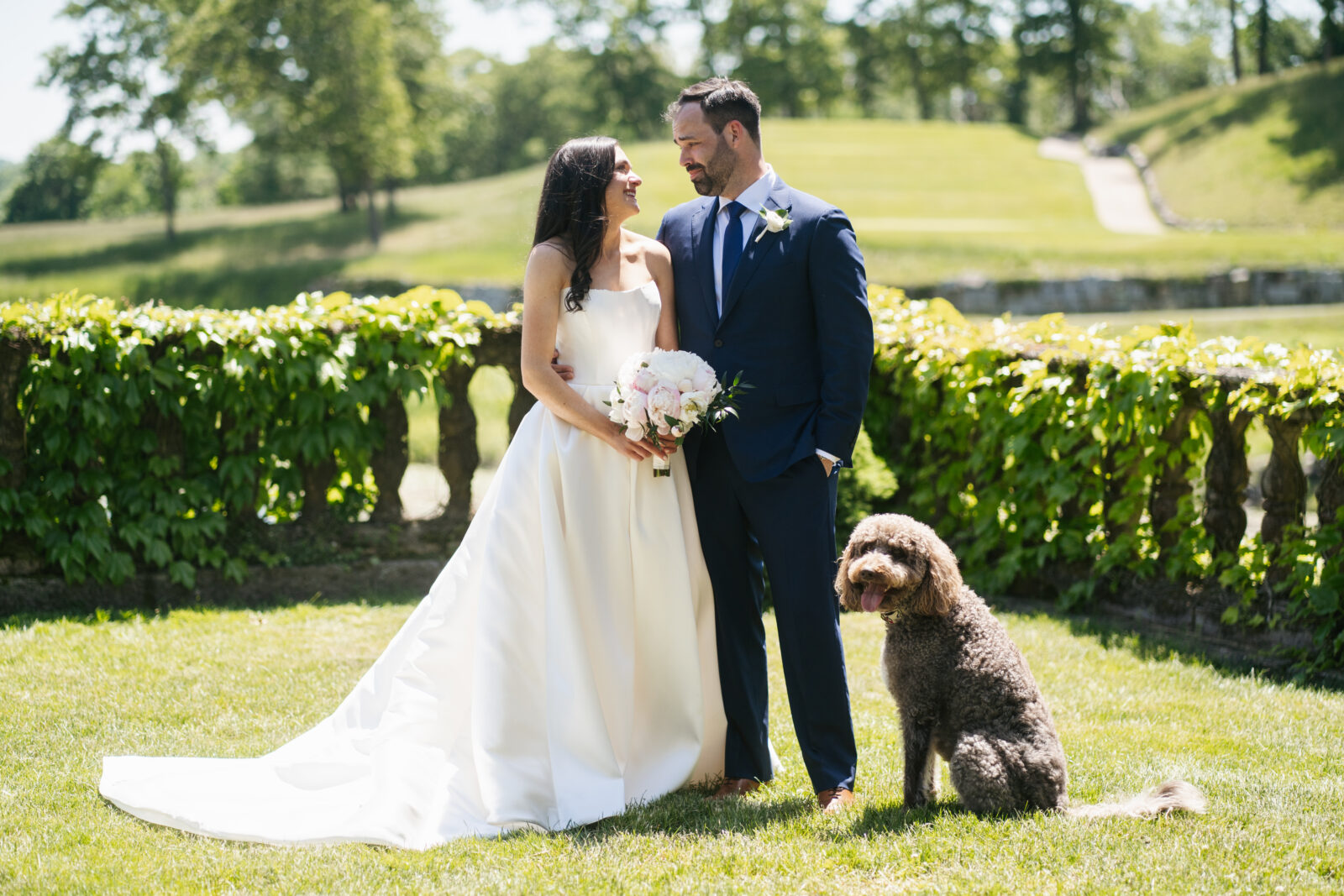 A magical moment as Alix and Wiley share their first look, filled with pure excitement and love. Wiley’s face lights up in awe as he sees Alix for the first time in her beautiful wedding gown, marking the beginning of their next chapter together. Their connection is undeniable, with their pup by their side to share in the joy.