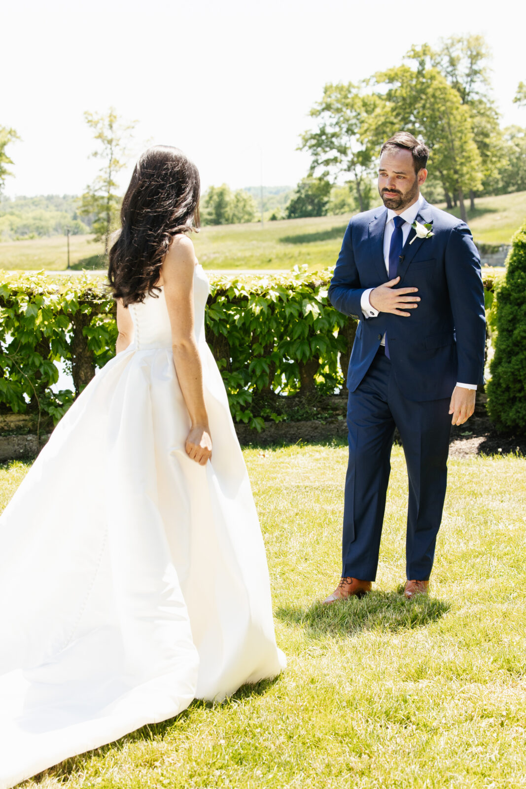 A magical moment as Alix and Wiley share their first look, filled with pure excitement and love. Wiley’s face lights up in awe as he sees Alix for the first time in her beautiful wedding gown, marking the beginning of their next chapter together. Their connection is undeniable, with their pup by their side to share in the joy.