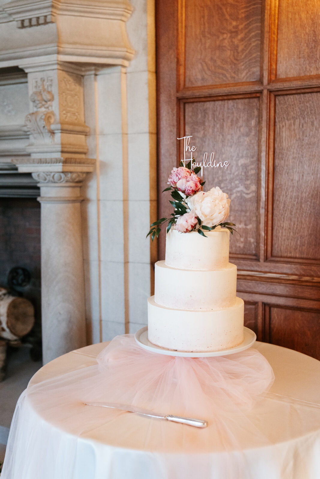 A close-up shot showcasing the stunning wedding details, including custom cufflinks, delicate floral arrangements, and the elegant invitations, all thoughtfully planned to reflect the couple’s personal style and love for one another.