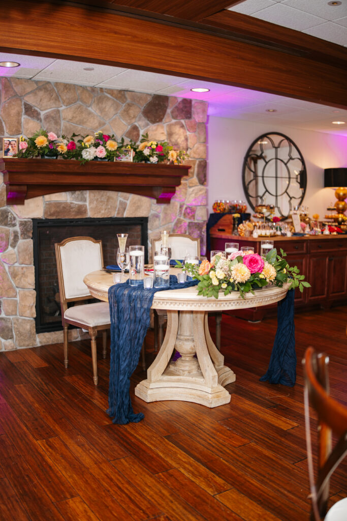 A beautiful image of a wedding at Bedford Village Inn in Bedford, capturing the couple in front of the venue’s charming New England-style architecture. The venue’s rustic elegance, with its lush gardens and timeless details, creates a warm and inviting atmosphere. The soft lighting and quaint surroundings make it the perfect backdrop for a classic, intimate celebration.