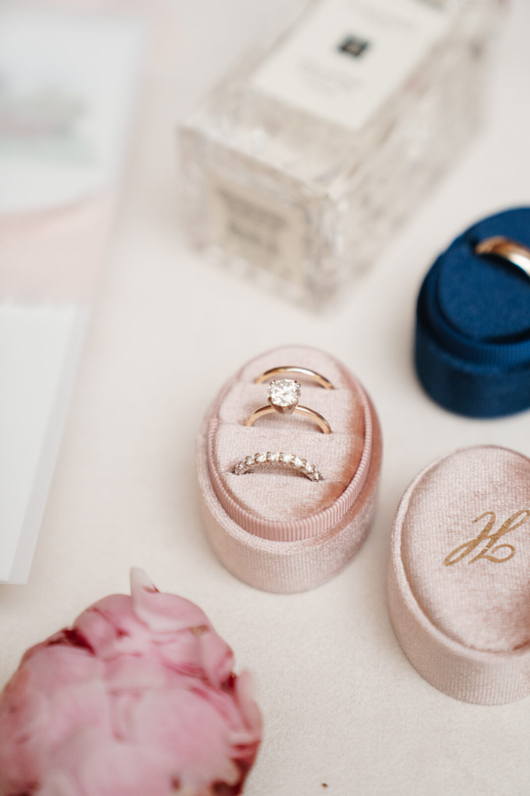 A close-up shot showcasing the stunning wedding details, including custom cufflinks, delicate floral arrangements, and the elegant invitations, all thoughtfully planned to reflect the couple’s personal style and love for one another.