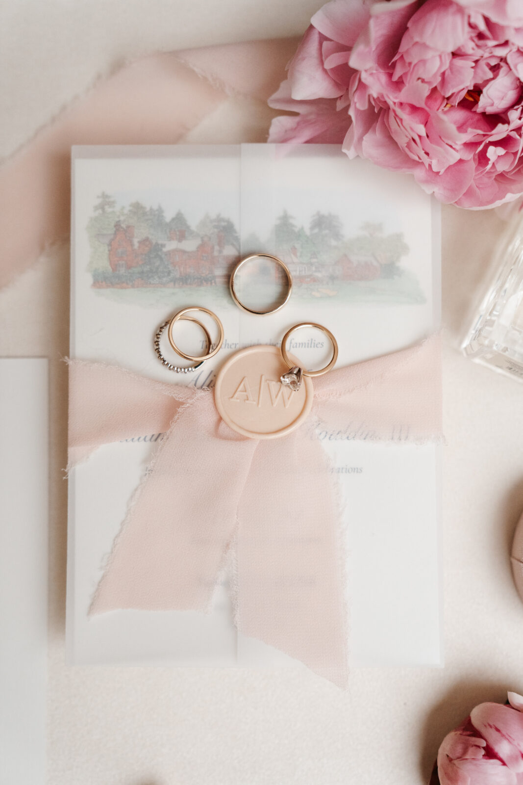 A close-up shot showcasing the stunning wedding details, including custom cufflinks, delicate floral arrangements, and the elegant invitations, all thoughtfully planned to reflect the couple’s personal style and love for one another.