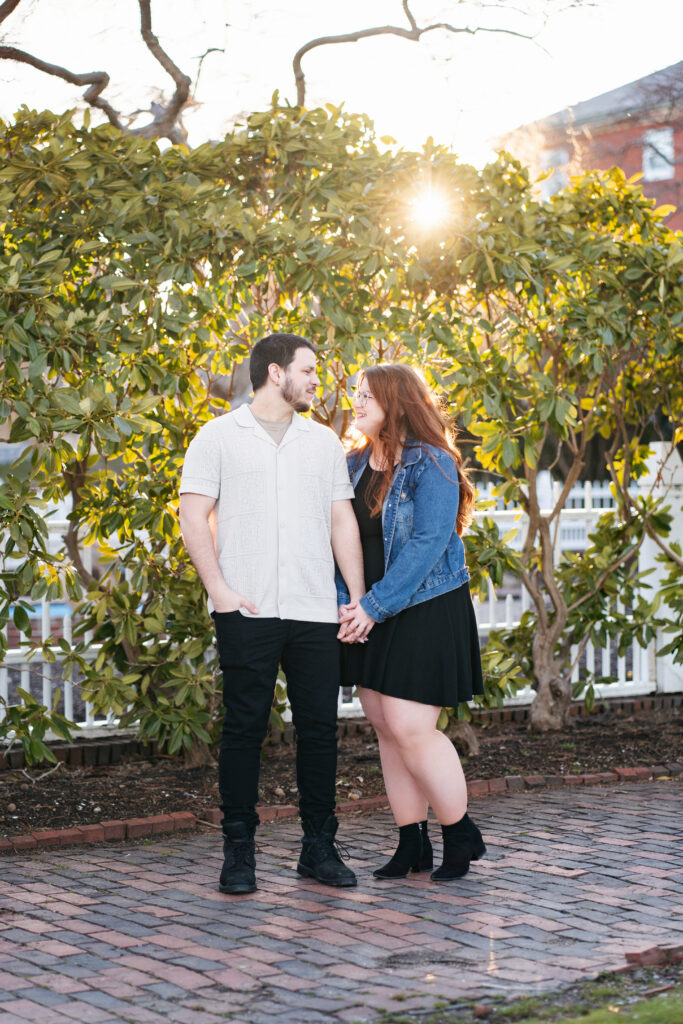 
A vibrant, candid photo of a wedding couple sharing a joyful moment during their celebration, with soft, natural lighting highlighting the colors and emotions of the day. The image captures an authentic, in-between moment that showcases the couple’s connection and the love in the air.