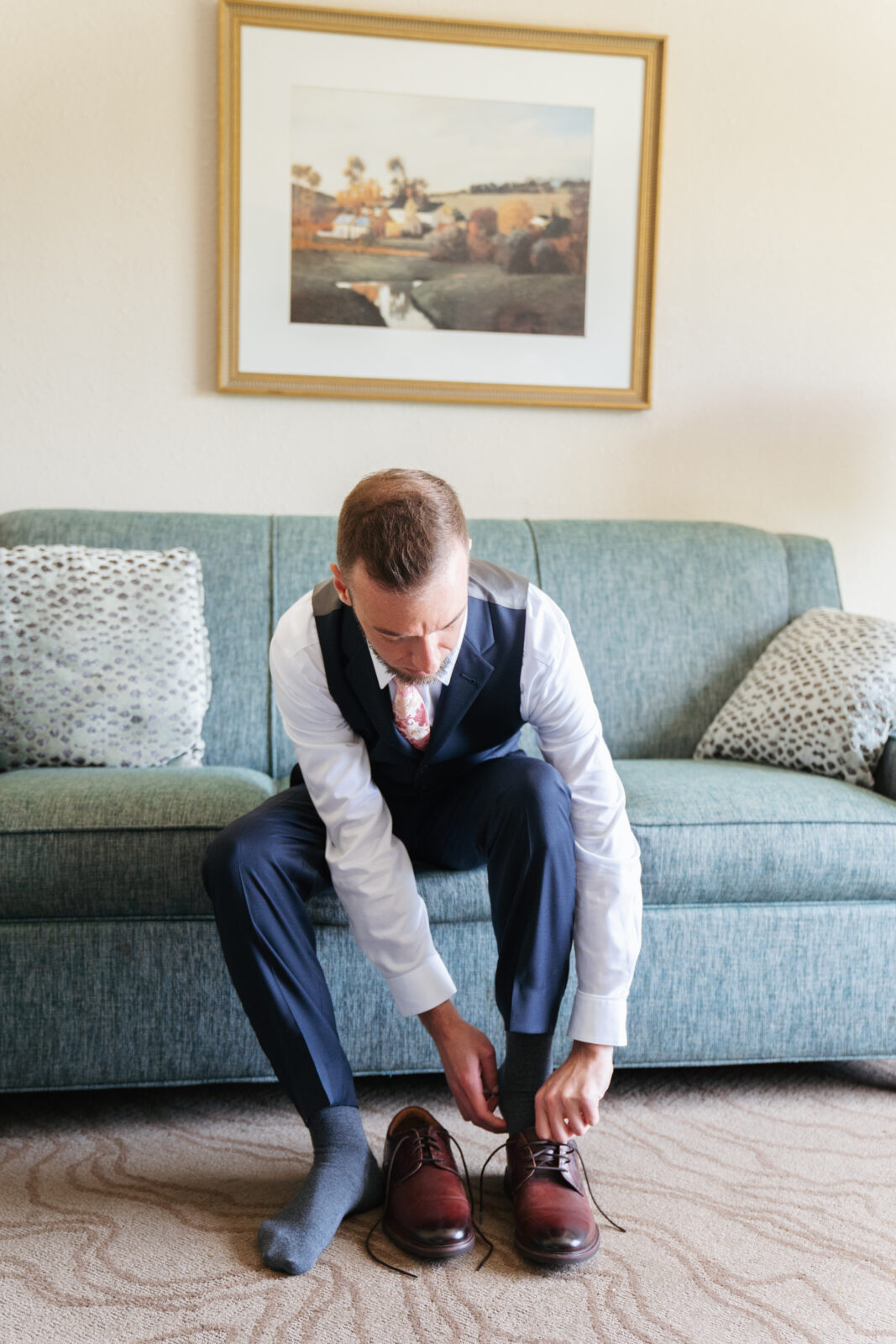 Grand View Wedding in Mendon, groom putting on shoe 