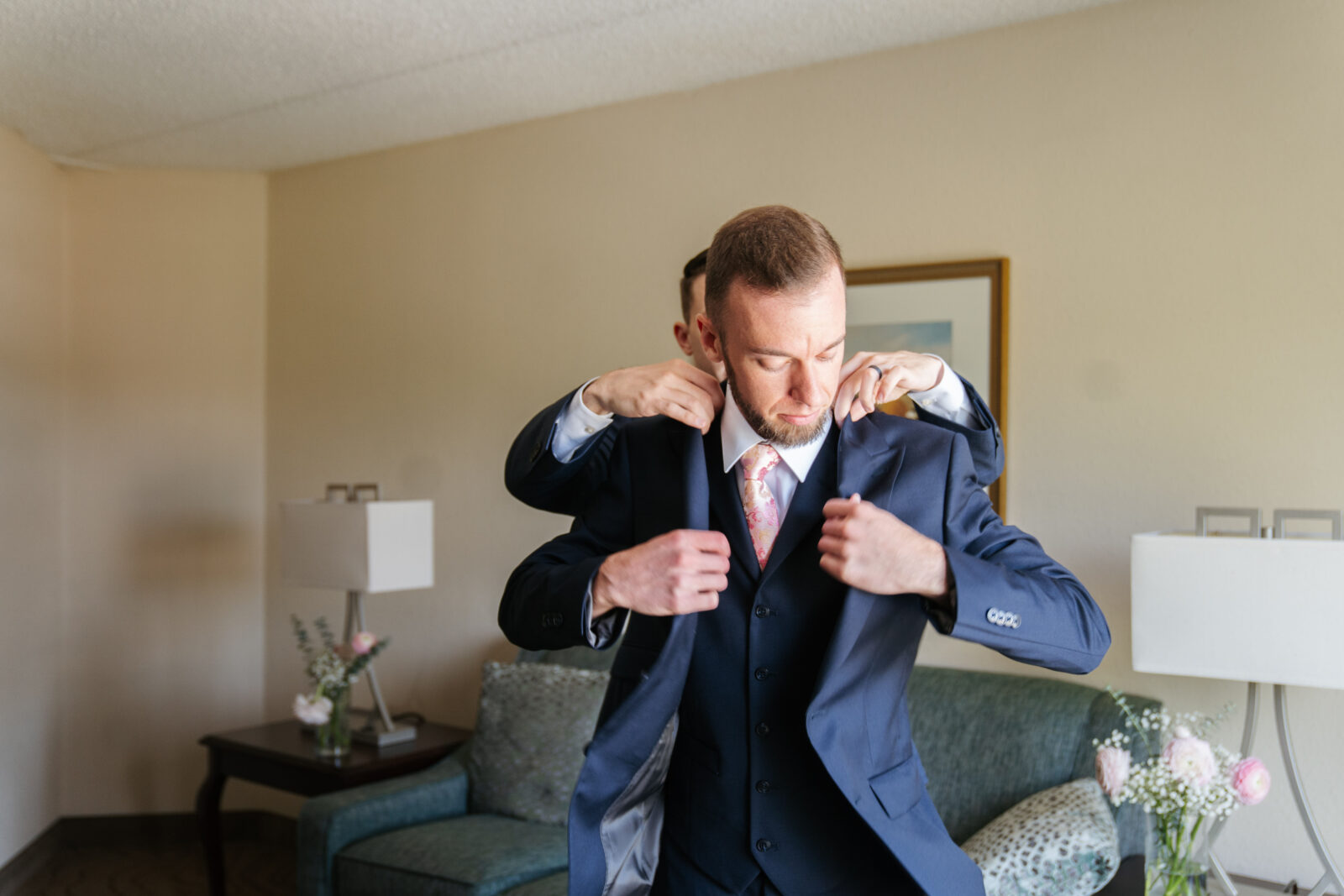 Grand View in Mendon Wedding, groom getting into suite 