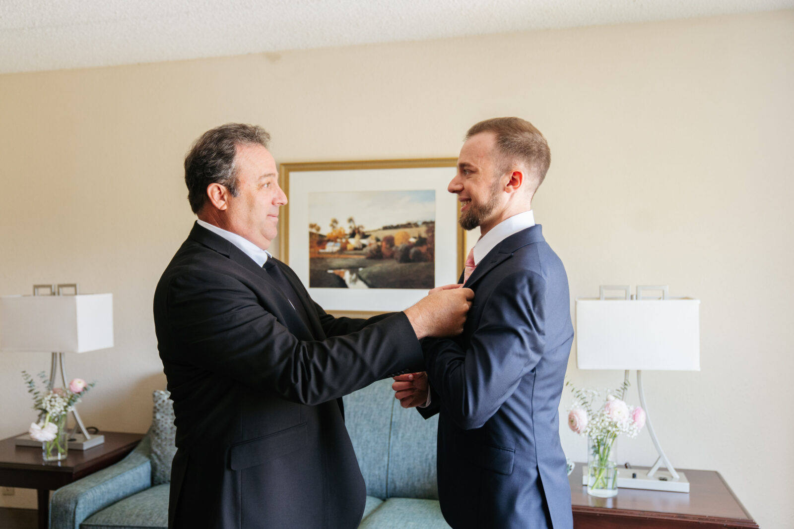 Grand View in Mendon Wedding, groom getting into suite 