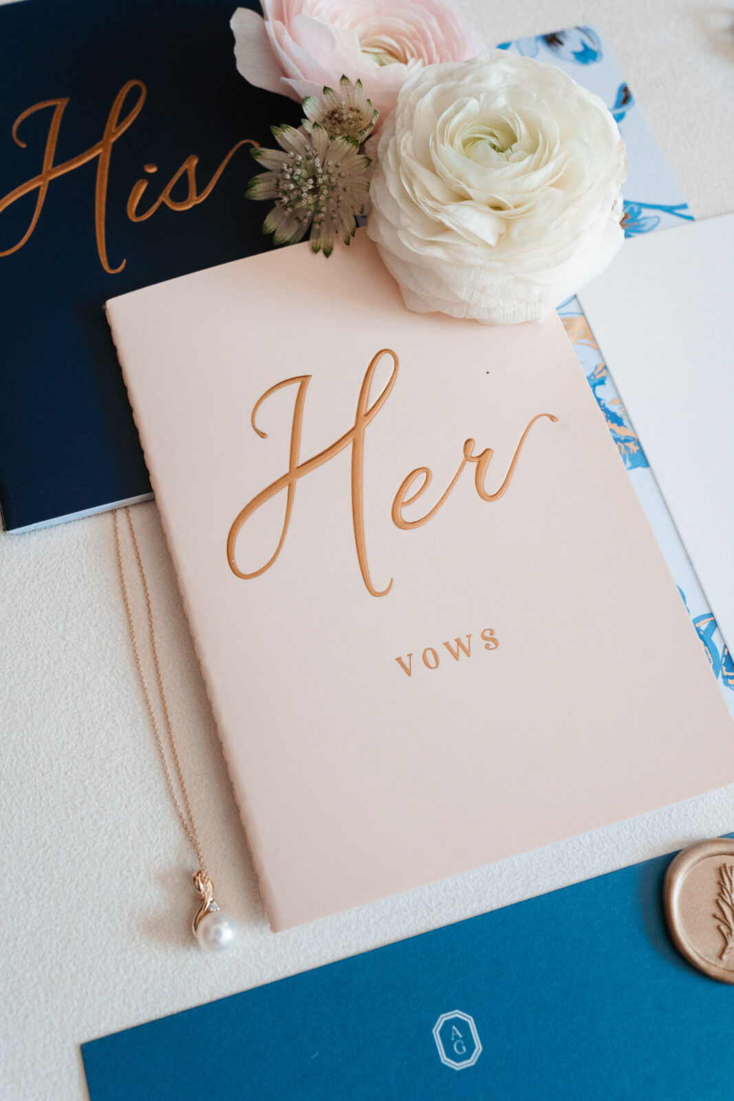 Elegant wedding flat lay with invitation suite, rings, and florals styled on soft linen at Waverly Oaks in Plymouth, MA.