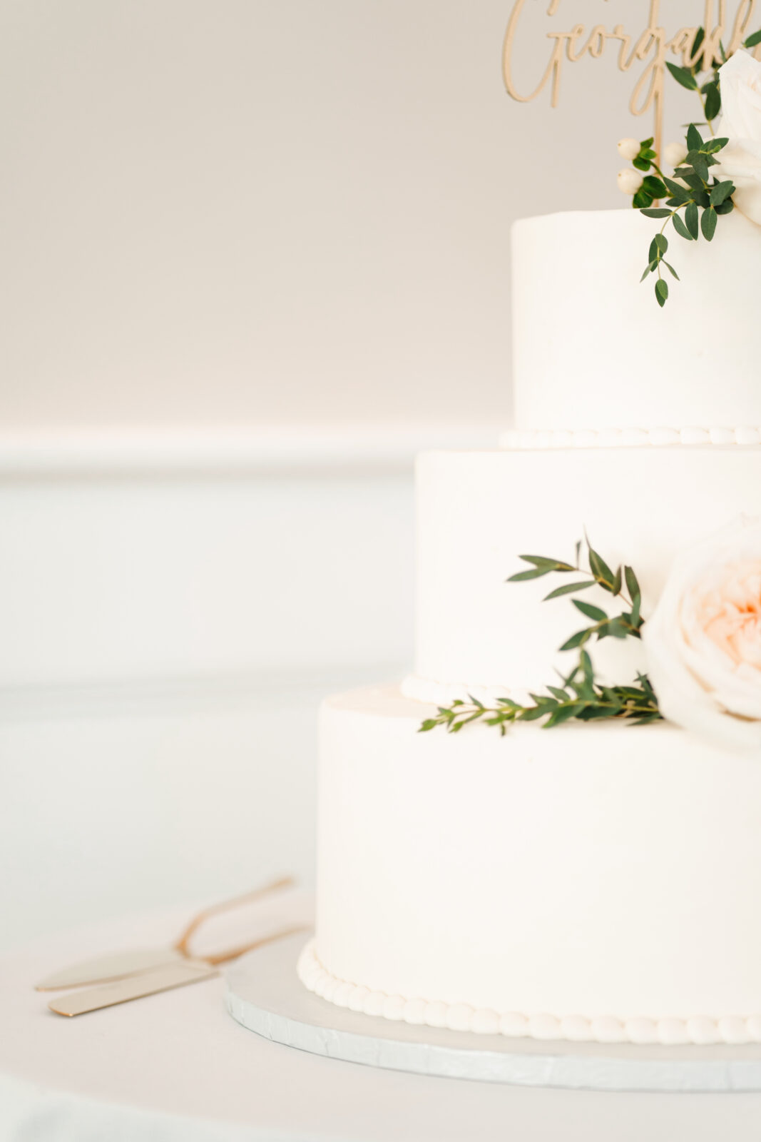 Elegant wedding flat lay with invitation suite, rings, and florals styled on soft linen at Waverly Oaks in Plymouth, MA.