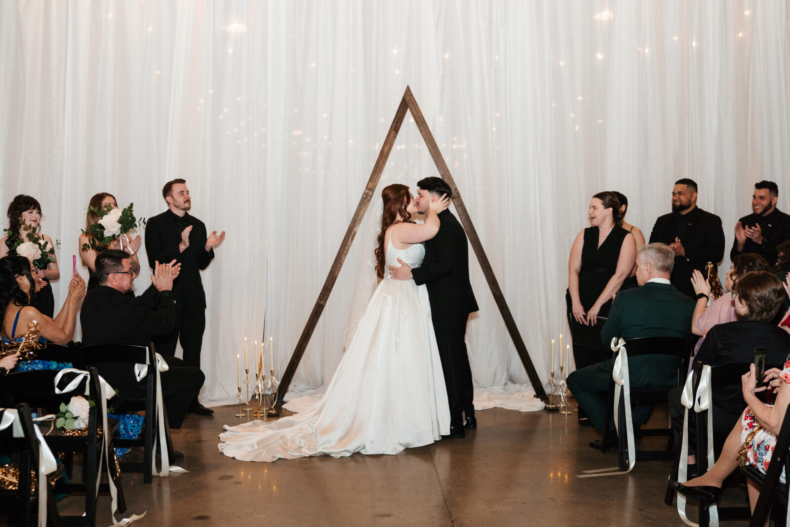 Couple exchanging vows with Disney-themed details during their wedding ceremony.