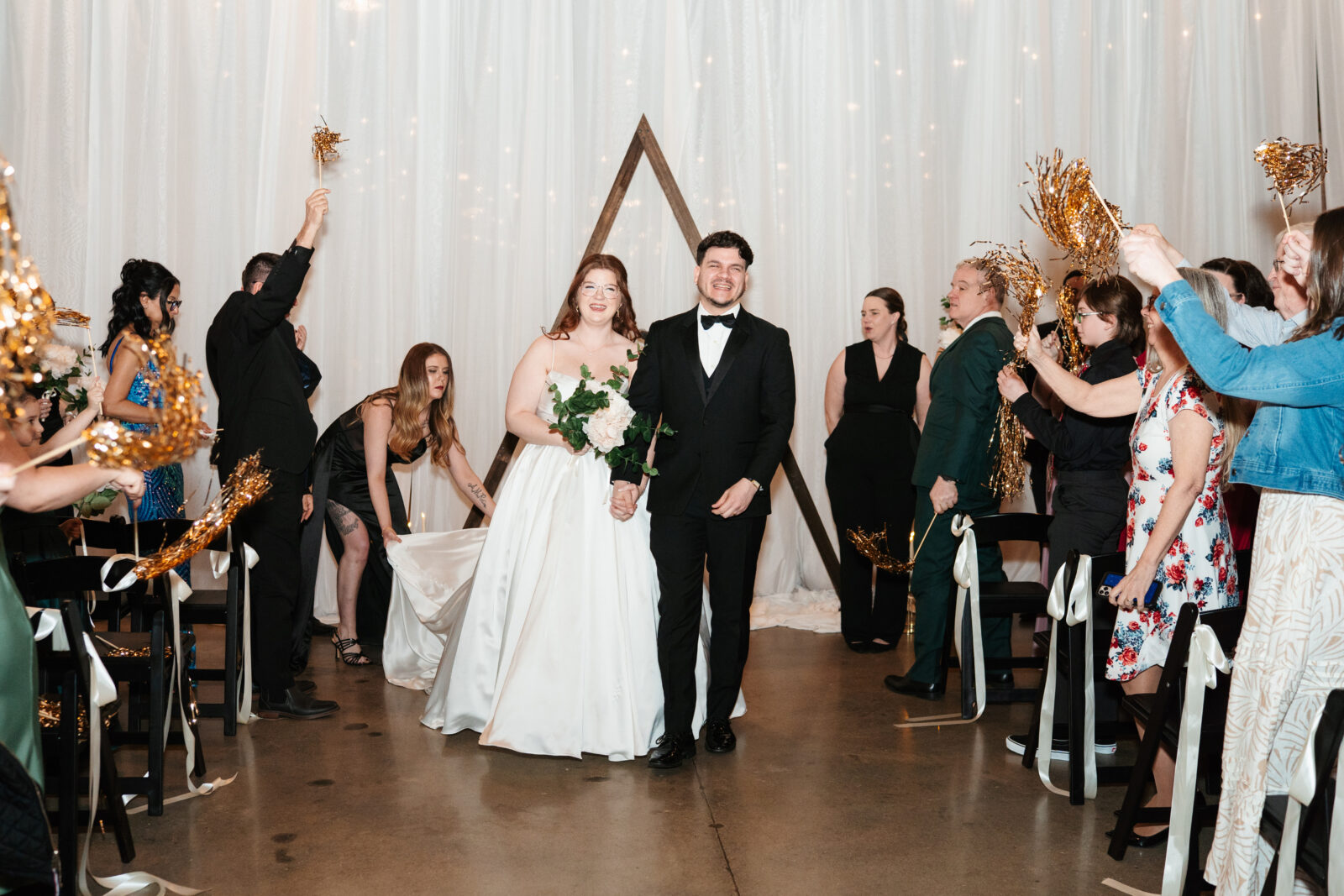 Couple exchanging vows with Disney-themed details during their wedding ceremony.