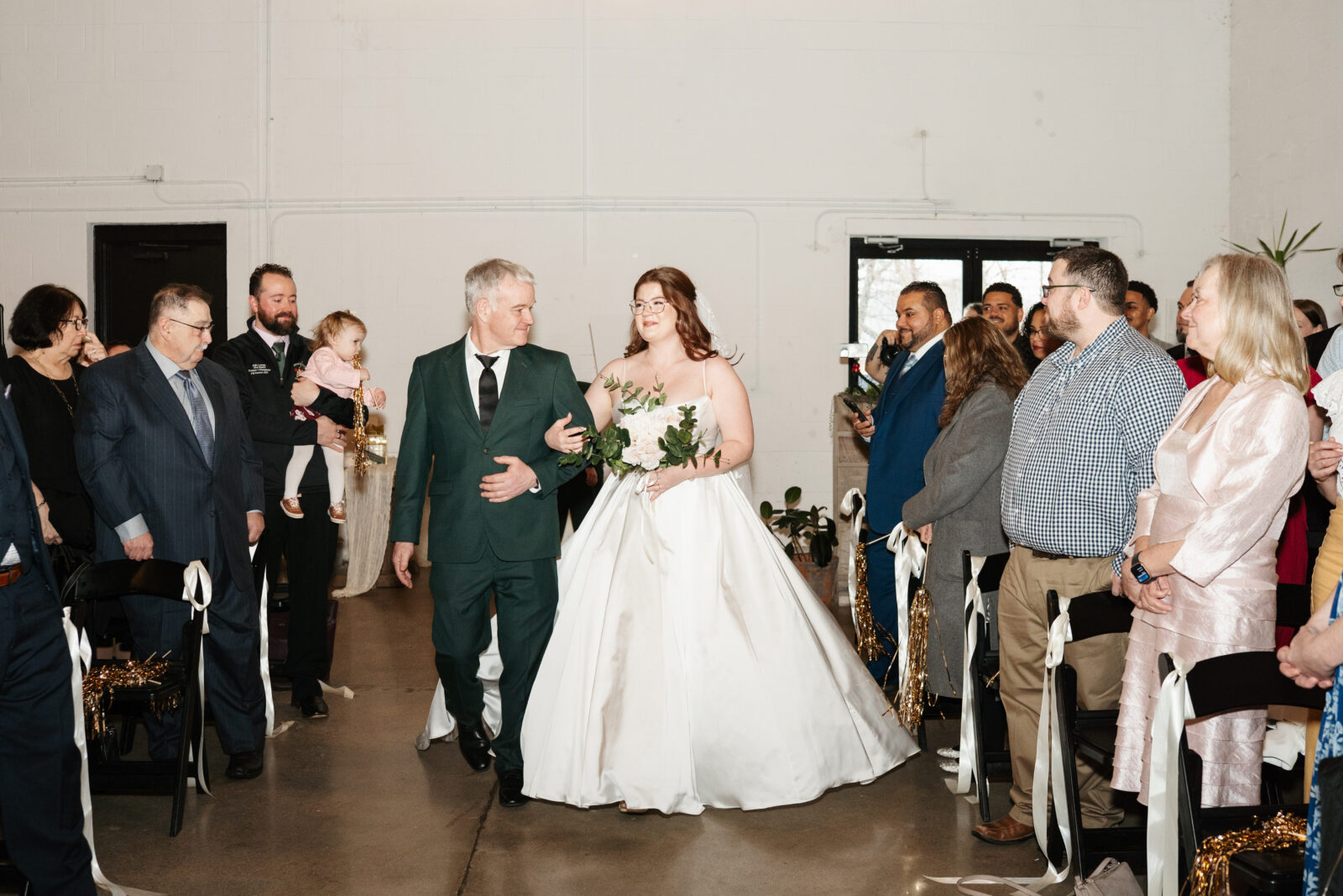 Emotional bride and groom seeing each other for the first time at their ceremony at The Venues at the Factory.