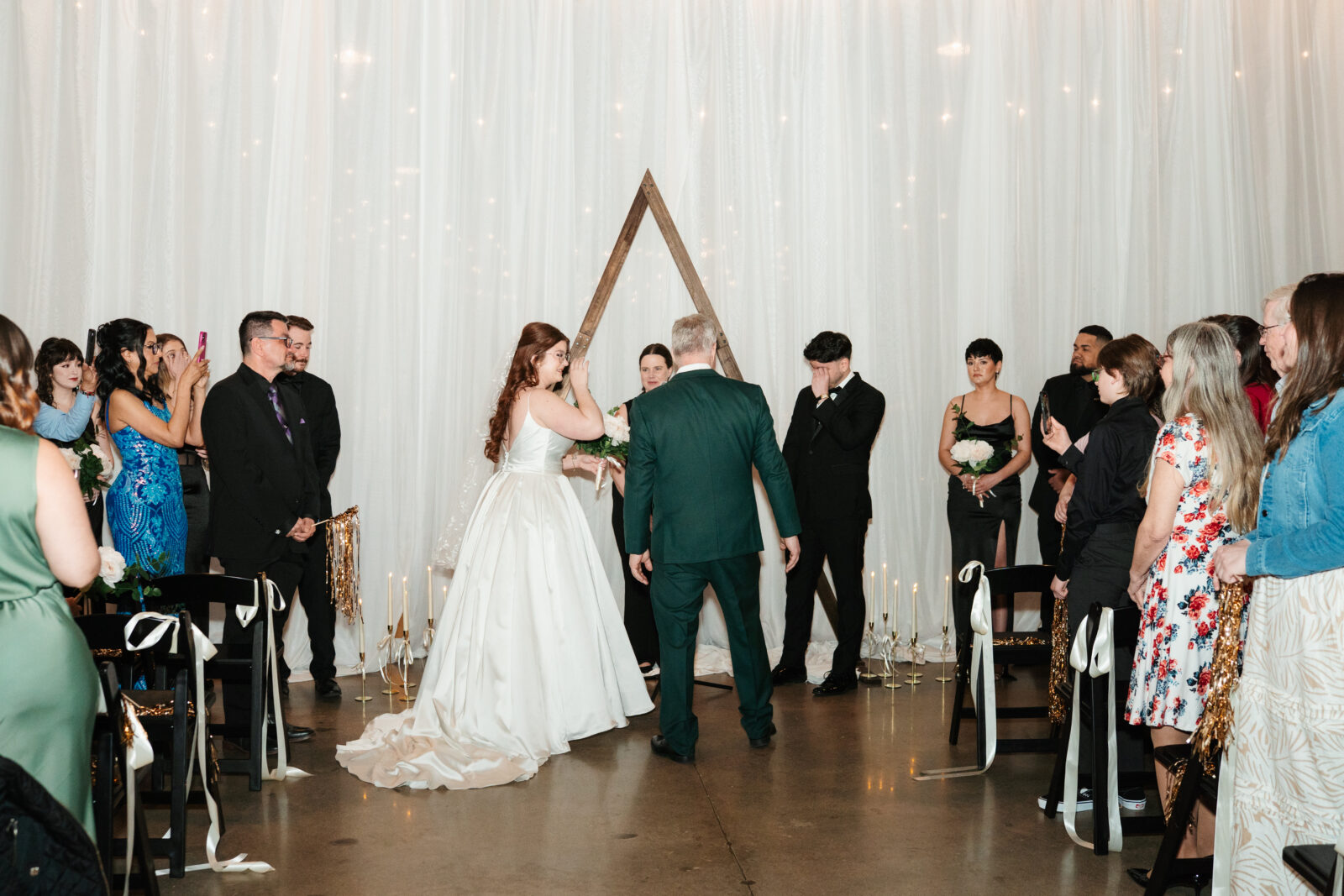 Emotional bride and groom seeing each other for the first time at their ceremony at The Venues at the Factory.