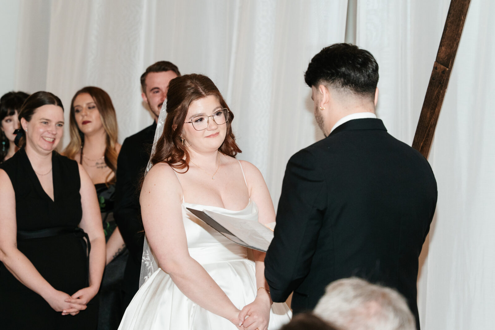 Emotional bride and groom seeing each other for the first time at their ceremony at The Venues at the Factory.