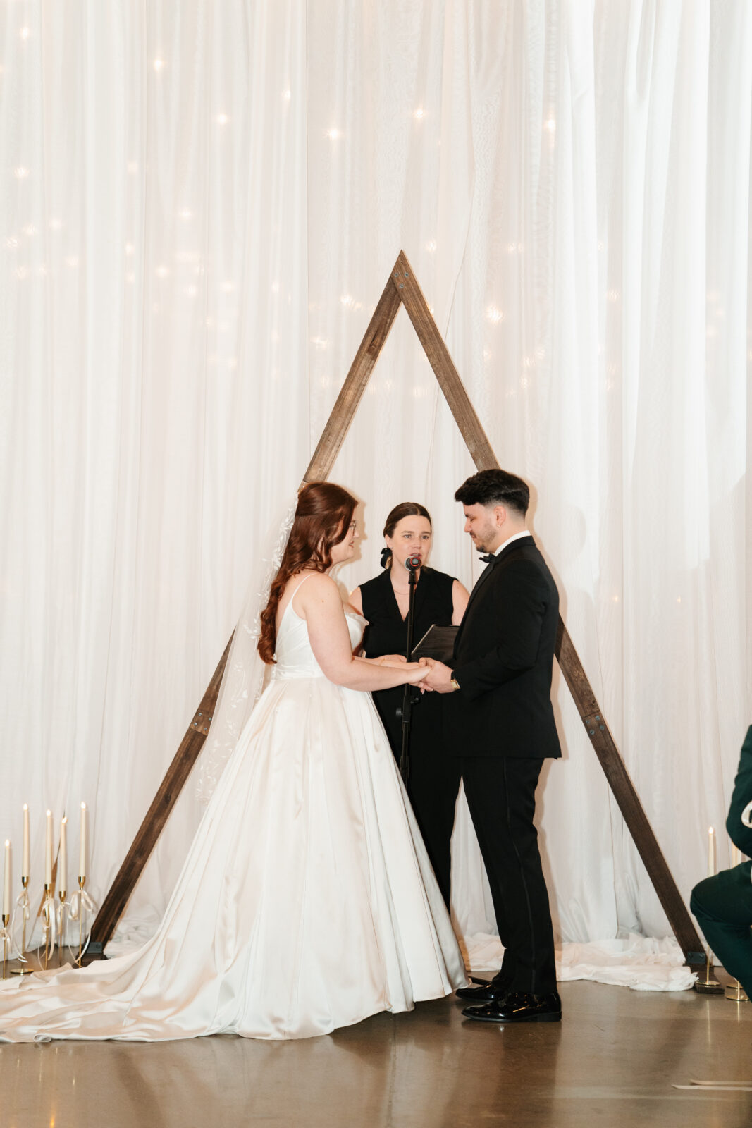 Emotional bride and groom seeing each other for the first time at their ceremony at The Venues at the Factory.