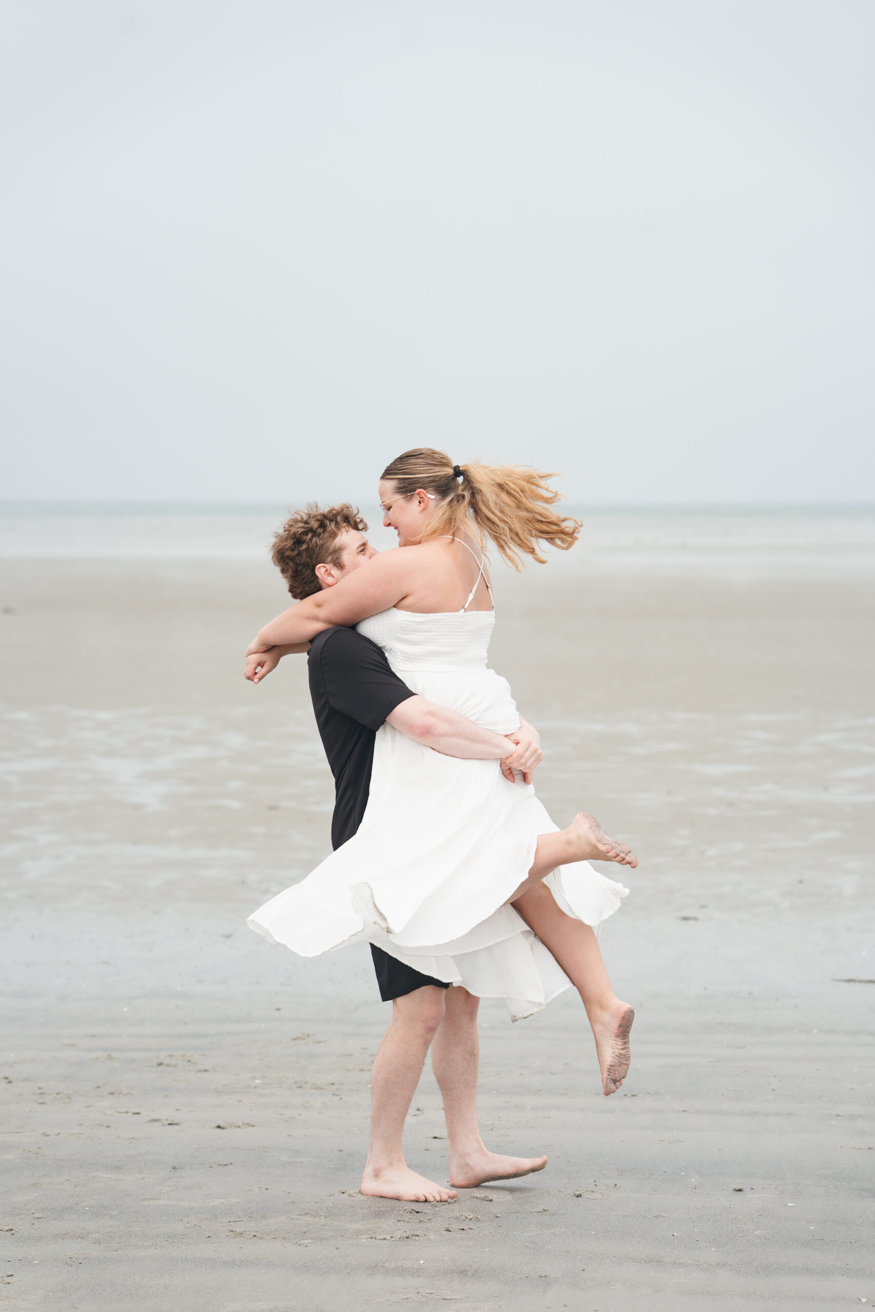 Couple twirling during engagement photos