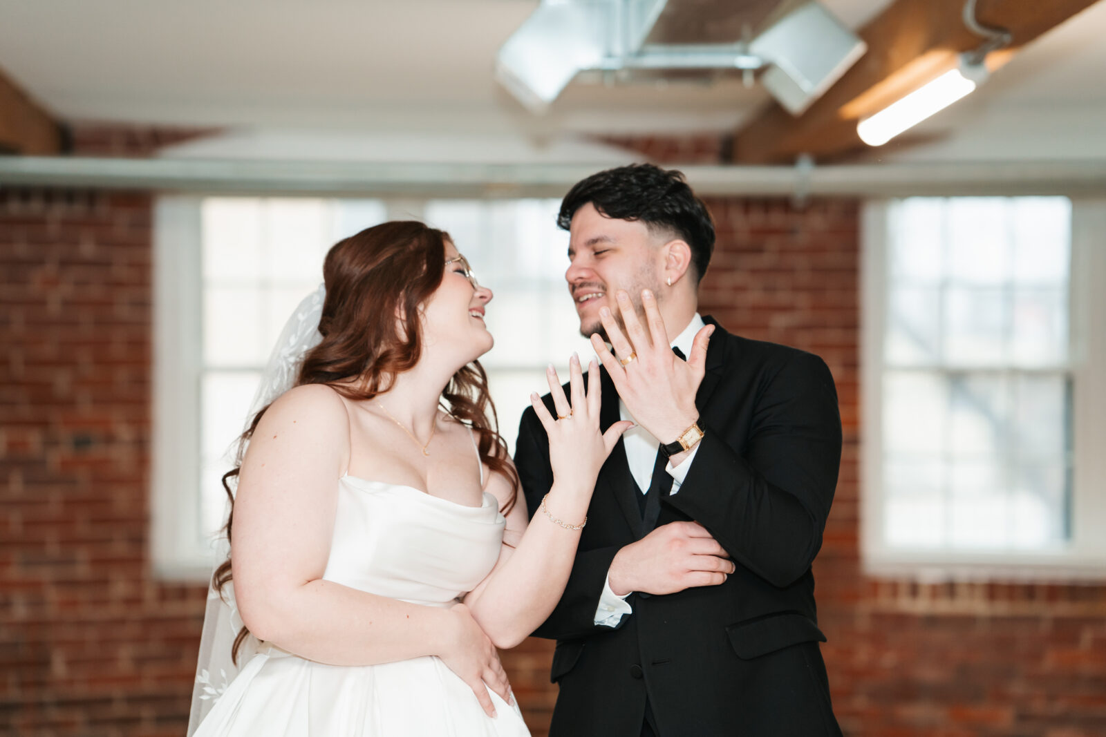 Industrial-chic wedding portraits of Emily and Nate inside The Venues at the Factory.