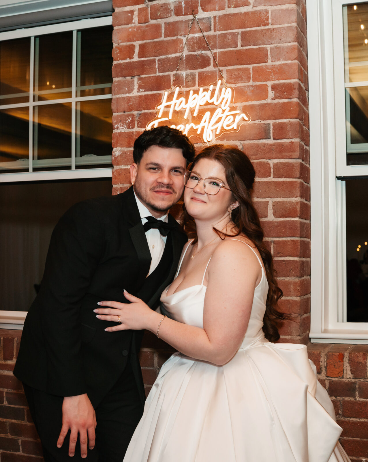 Industrial-chic wedding portraits of Emily and Nate inside The Venues at the Factory.