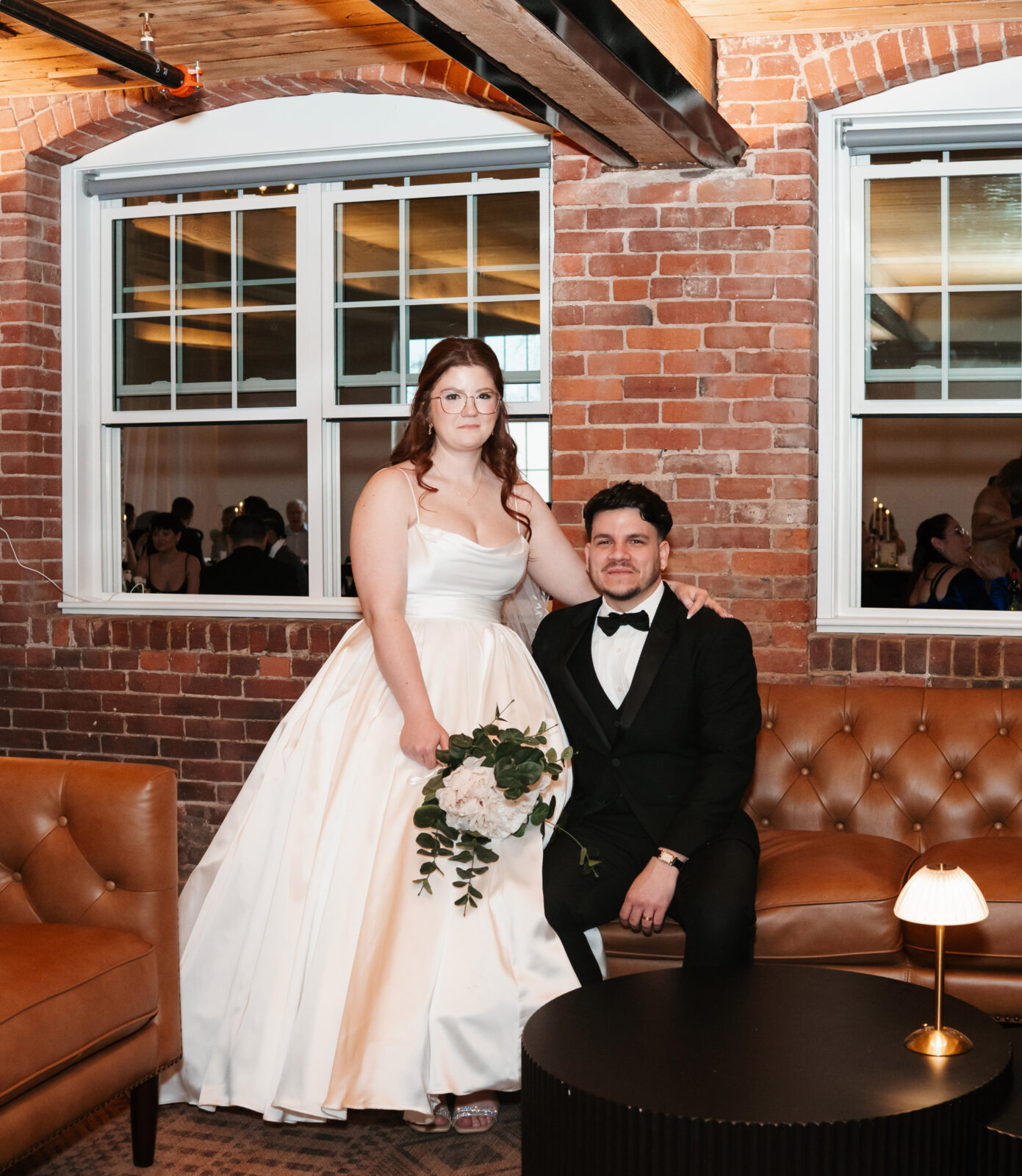 Industrial-chic wedding portraits of Emily and Nate inside The Venues at the Factory.