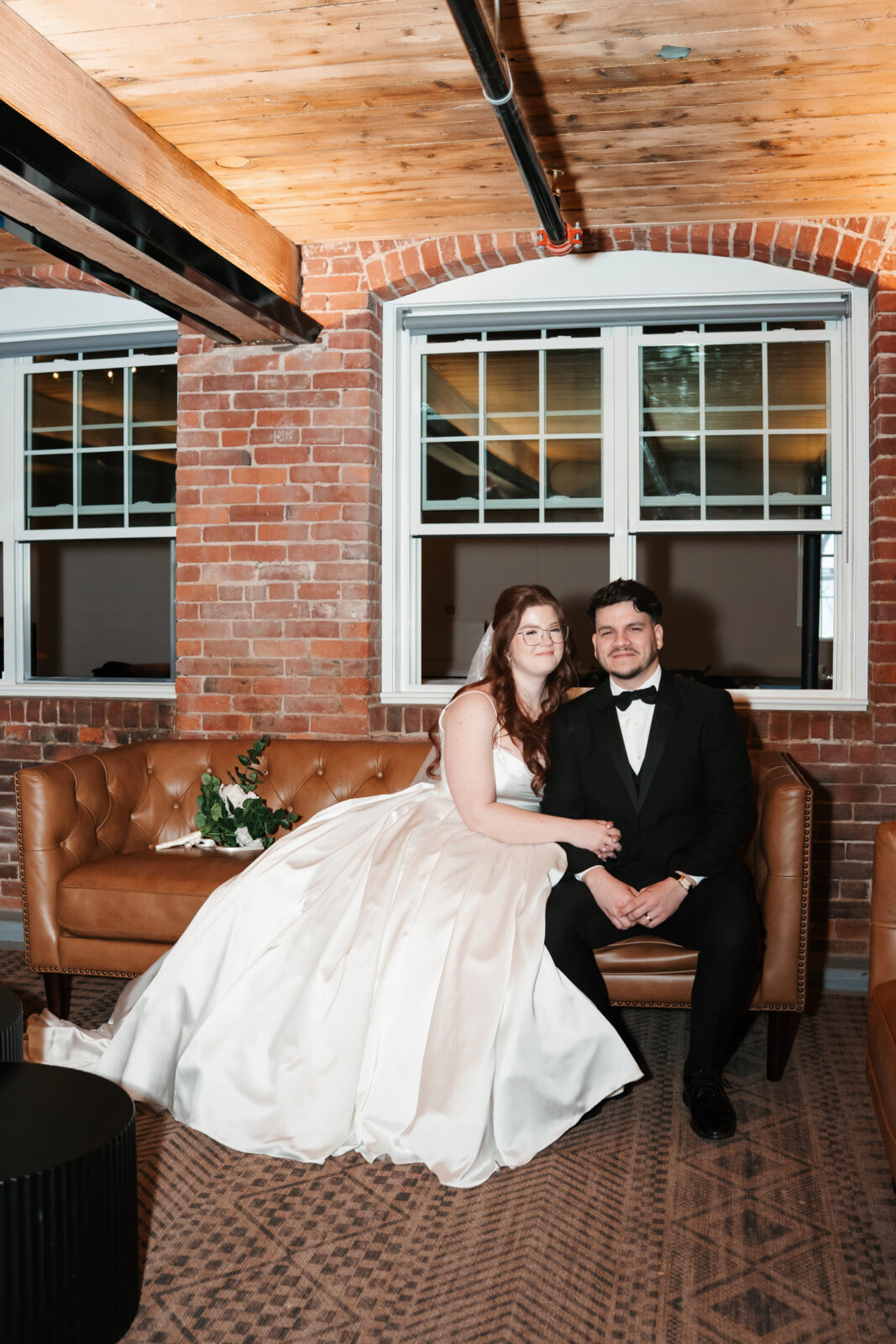 Industrial-chic wedding portraits of Emily and Nate inside The Venues at the Factory.