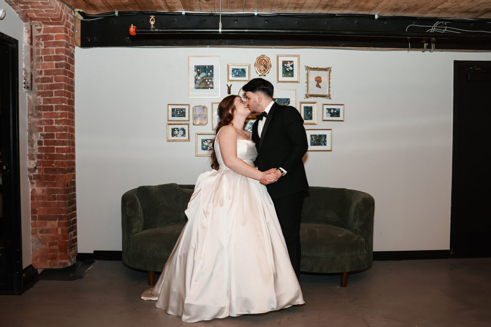 Industrial-chic wedding portraits of Emily and Nate inside The Venues at the Factory.