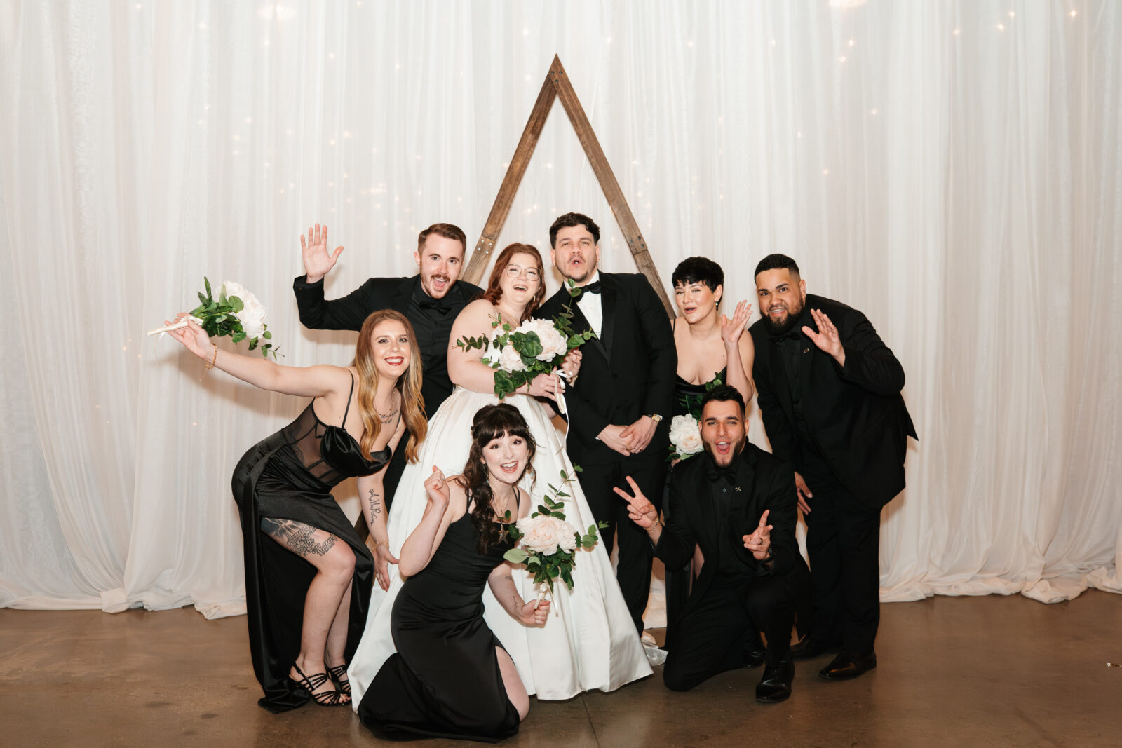 Wedding party and family portraits taken indoors at The Venues at the Factory on a rainy day.