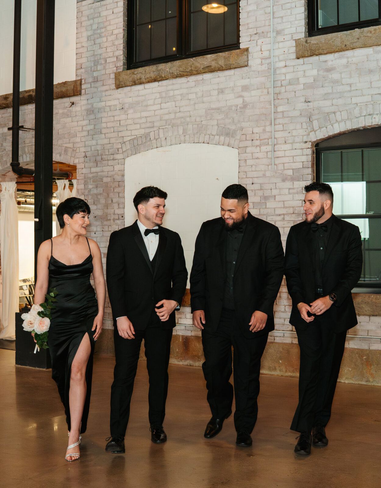 Wedding party and family portraits taken indoors at The Venues at the Factory on a rainy day.