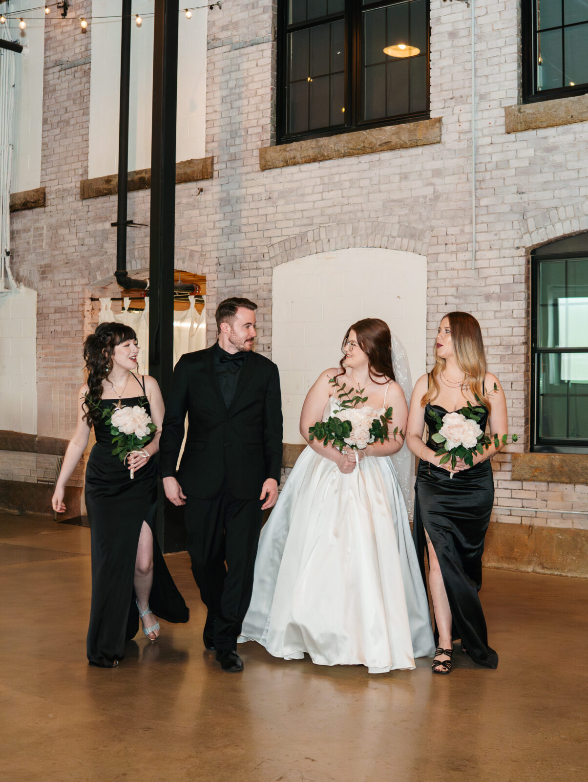 Wedding party and family portraits taken indoors at The Venues at the Factory on a rainy day.