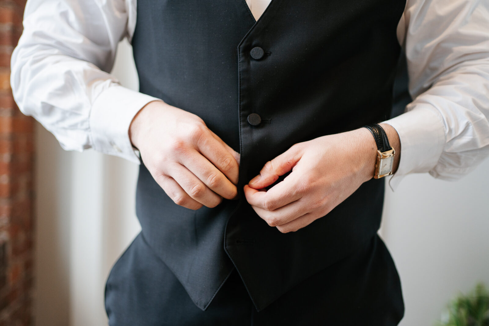 Bride getting ready in Airbnb suite inside The Venues at the Factory with natural light and elegant details.