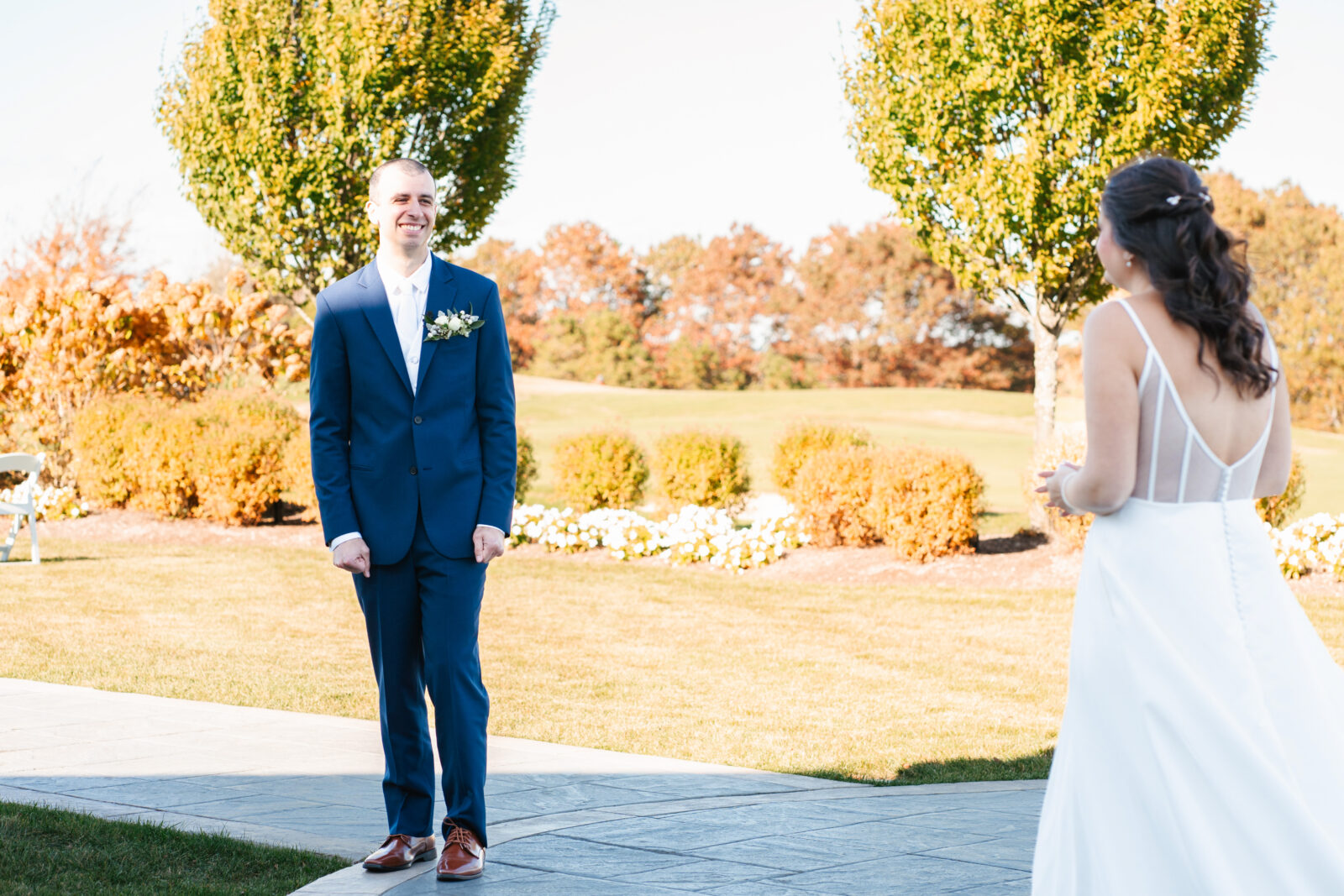 Bride and groom reading private vows in a quiet moment before the ceremony at Waverly Oaks in Plymouth, MA.