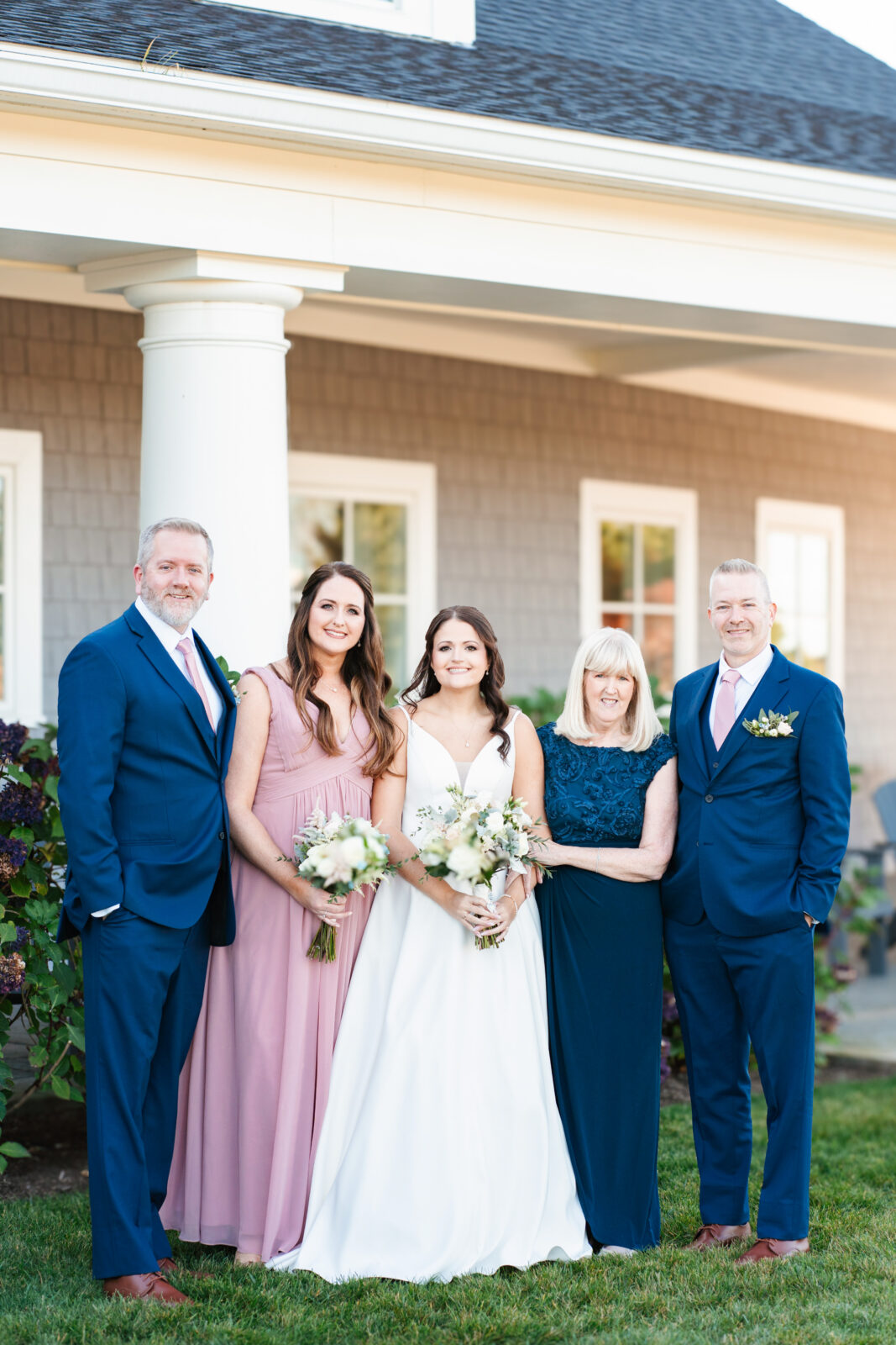 Bridal party celebrating with the couple on the lawn at Waverly Oaks in Plymouth, MA