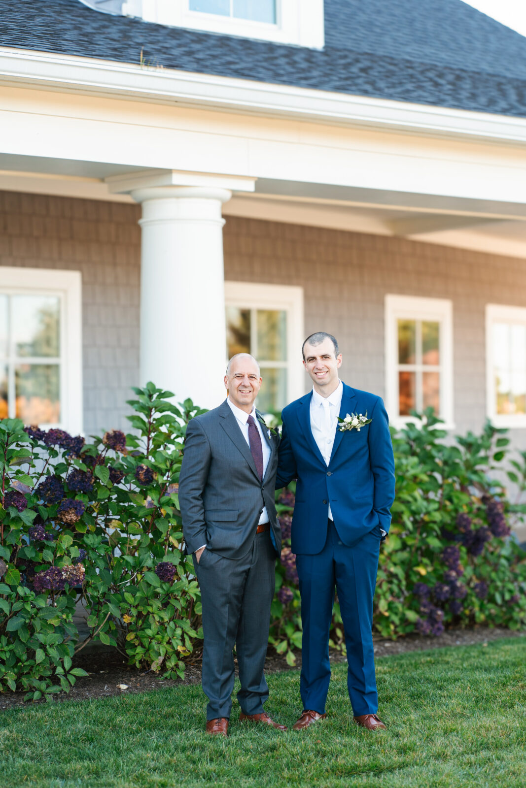 Bridal party celebrating with the couple on the lawn at Waverly Oaks in Plymouth, MA