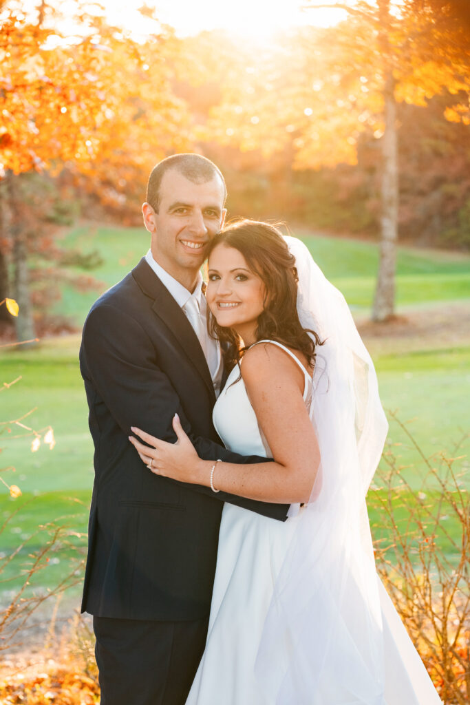 Bride and groom sharing a quiet moment at sunset on the golf course at Waverly Oaks, Plymouth, MA.