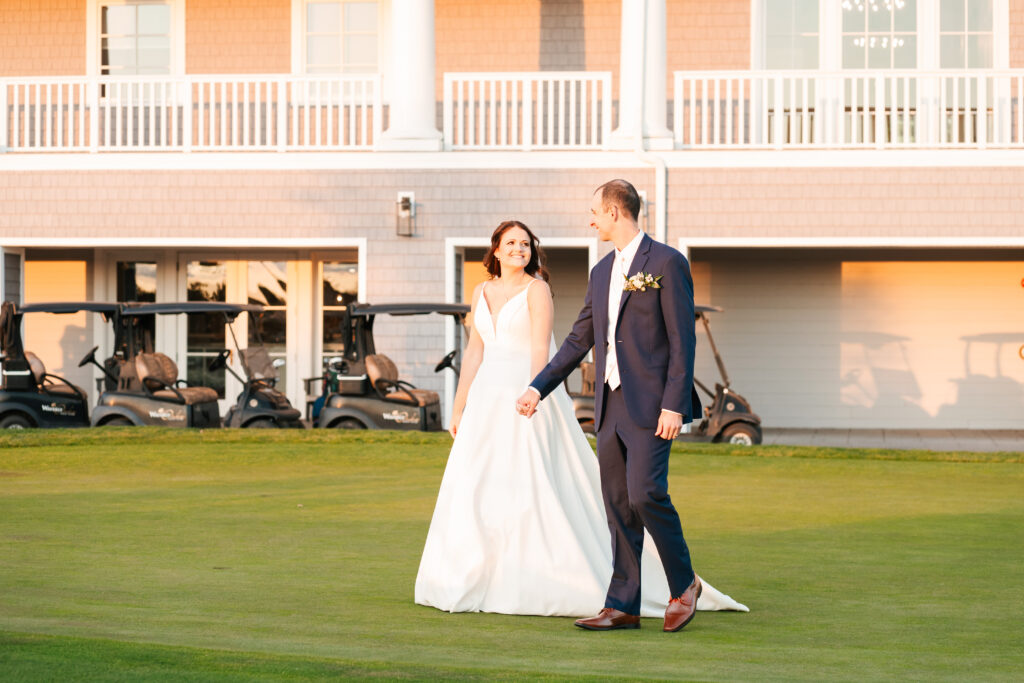 Bride and groom sharing a quiet moment at sunset on the golf course at Waverly Oaks, Plymouth, MA.