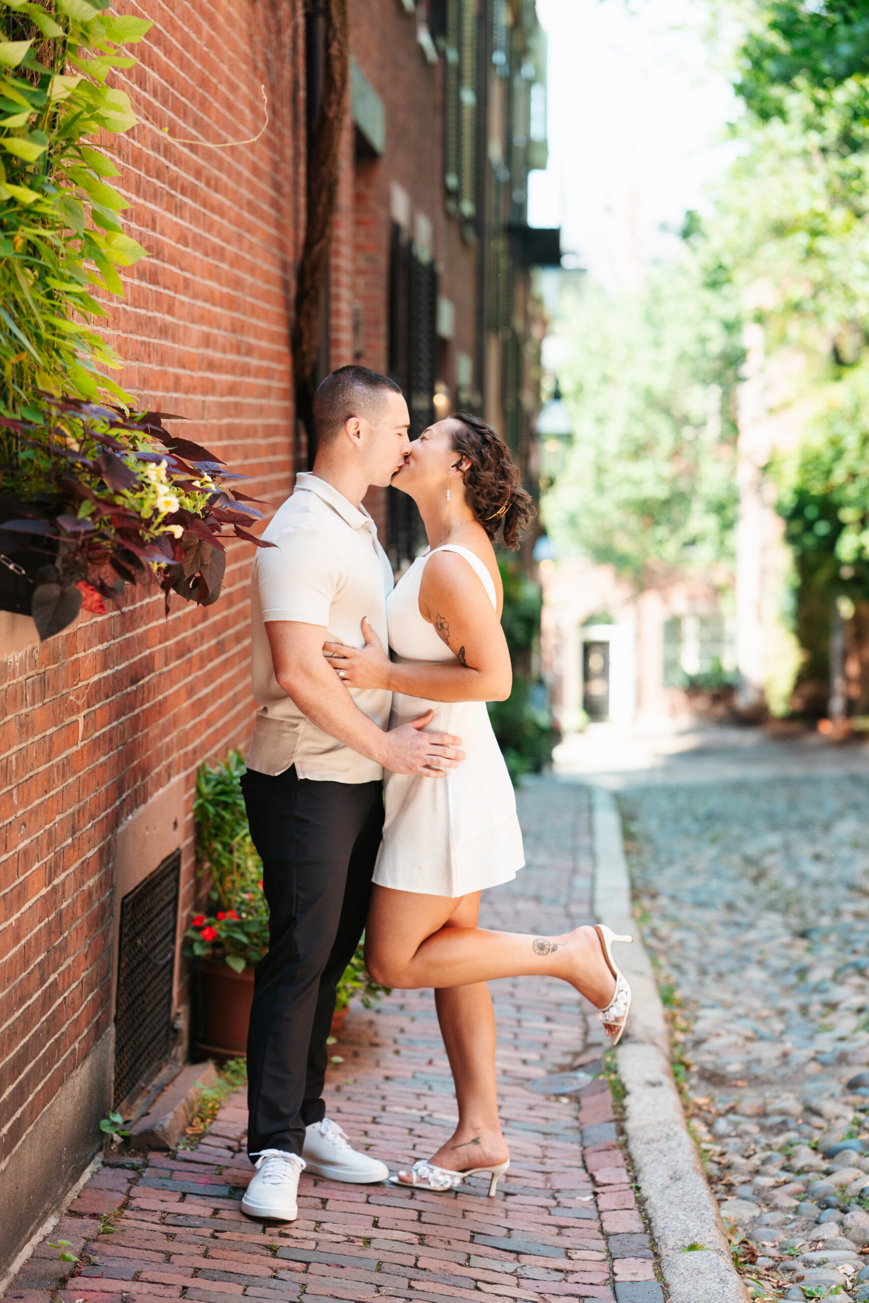 Natural engagement session in Boston with soft evening city light.