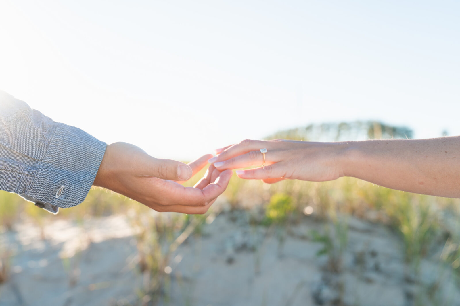 Romantic seaside engagement session at sunset.