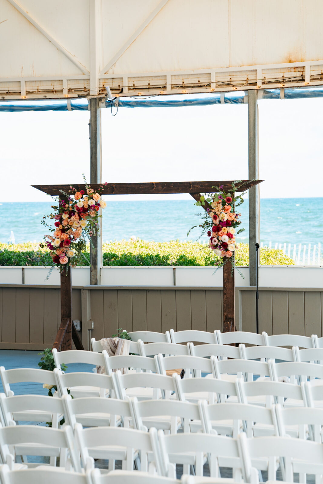 Open-air wedding reception tent overlooking the ocean