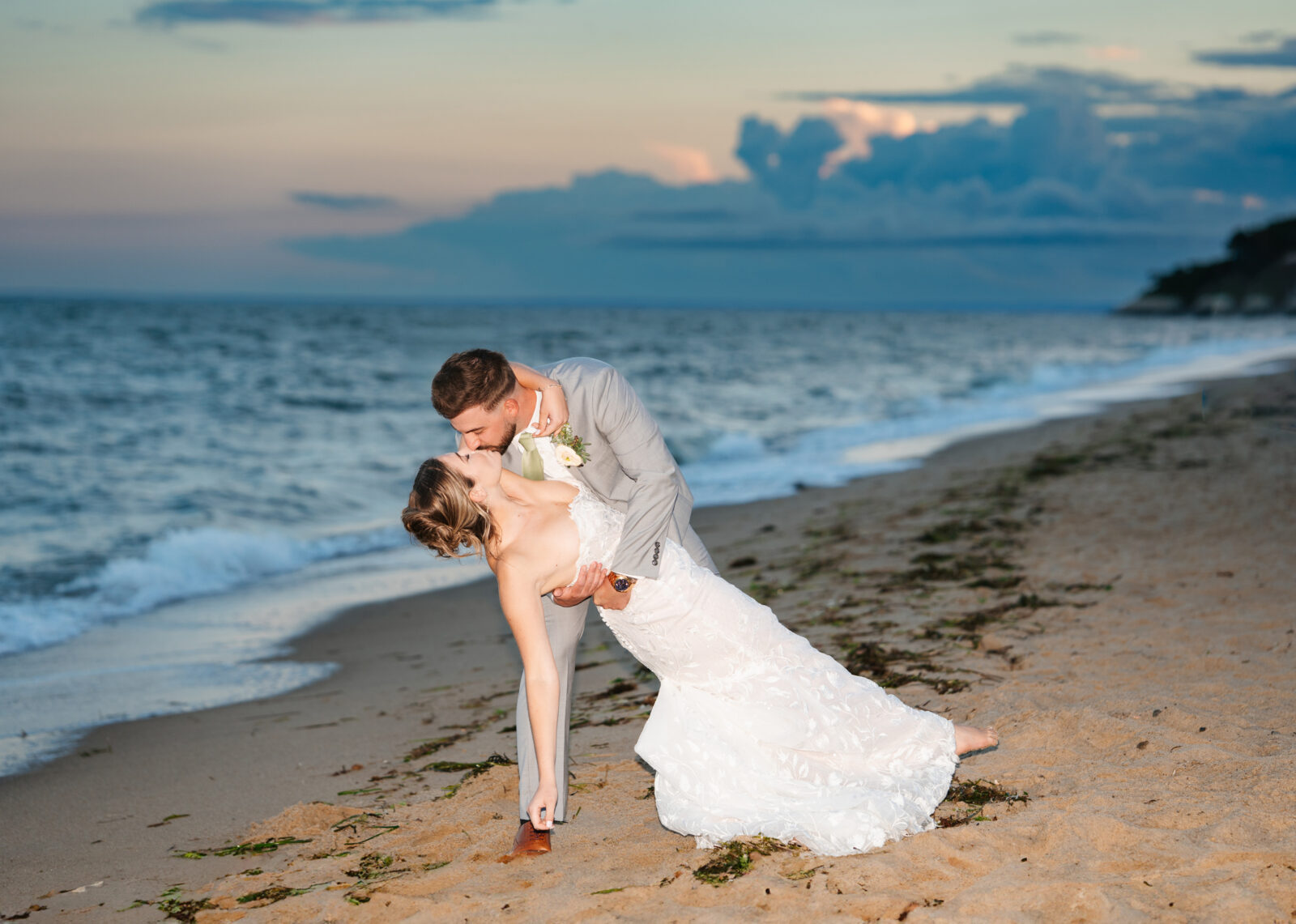 Bride and groom at sunset on the beach in Massachusetts
