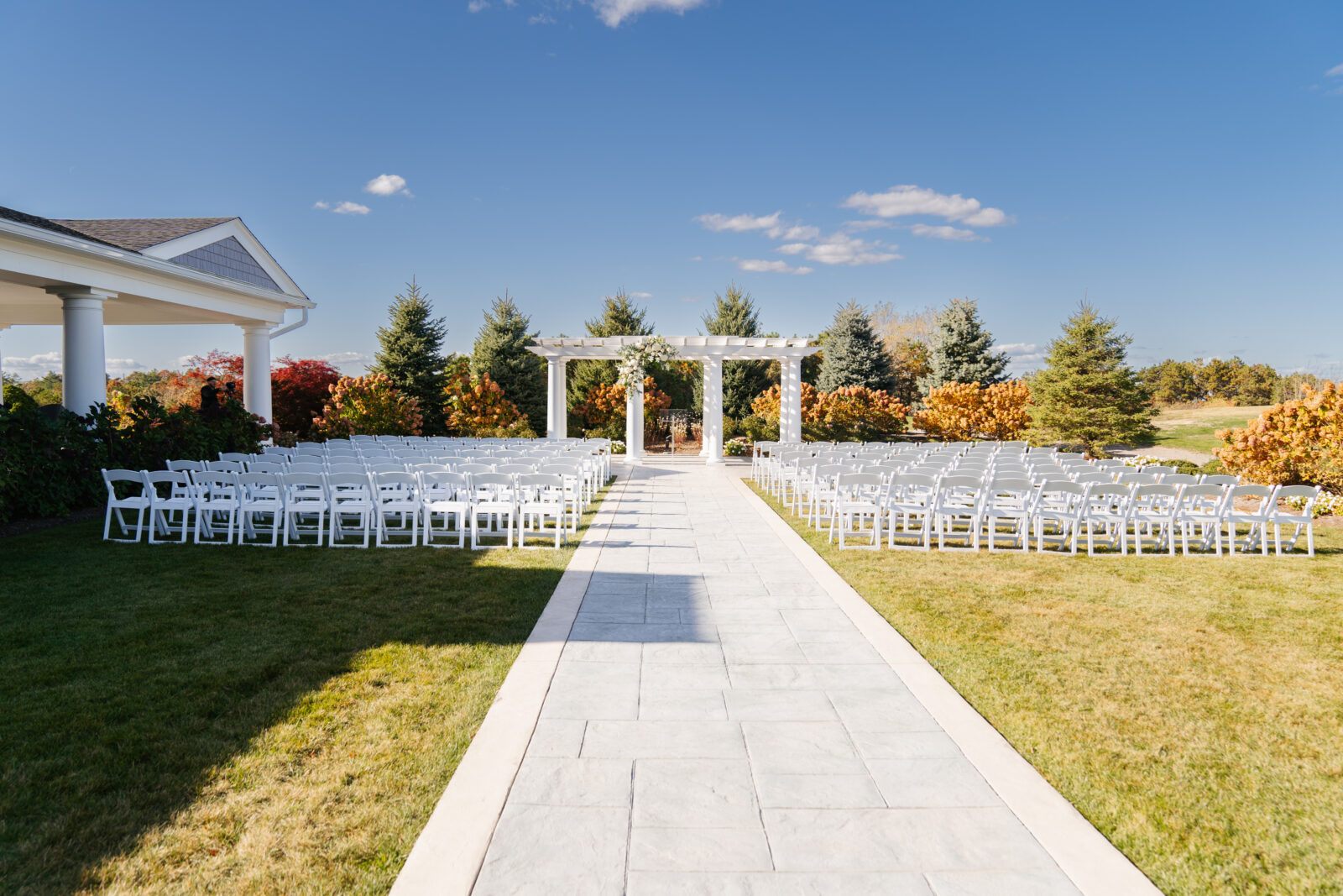 Wedding ceremony backdrop overlooking the greens at Waverly Oaks