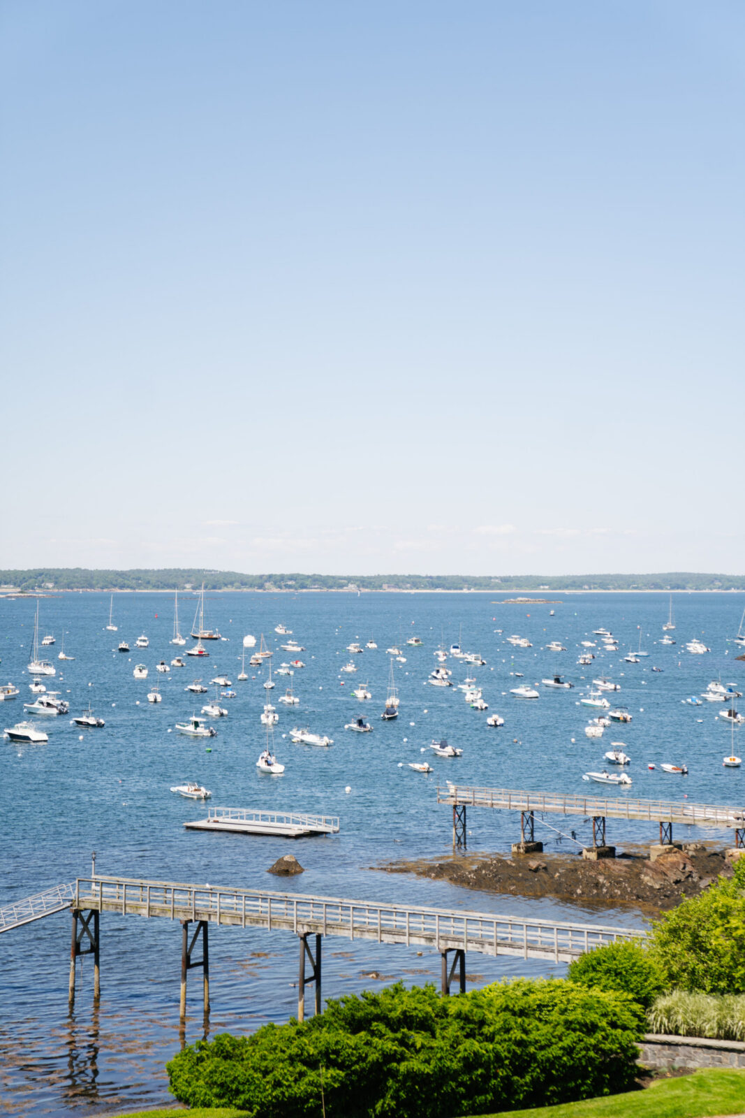 Mass wedding venue Exterior of Eastern Yacht Club overlooking Marblehead Harbor MA