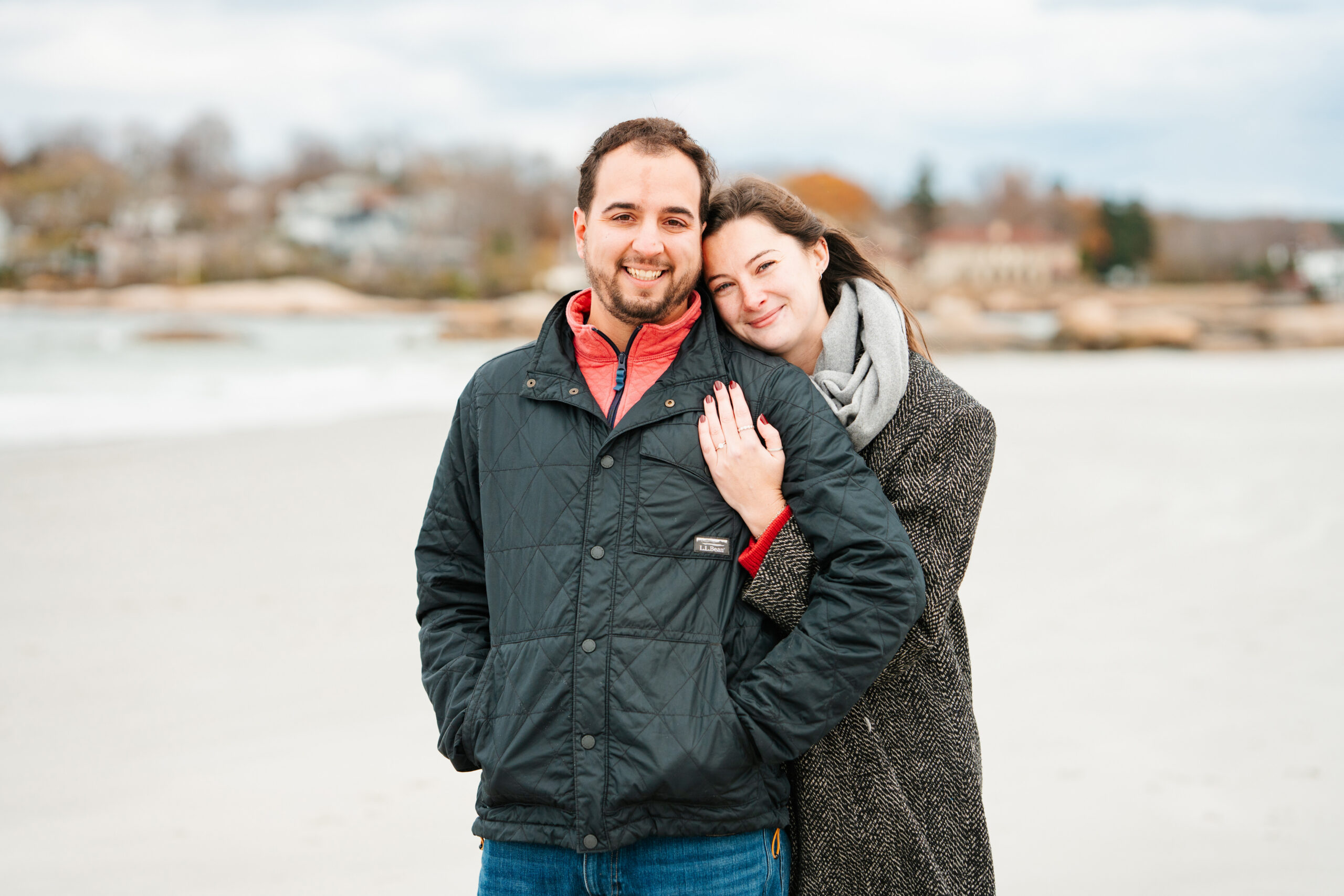 couple embracing on the beach during photos