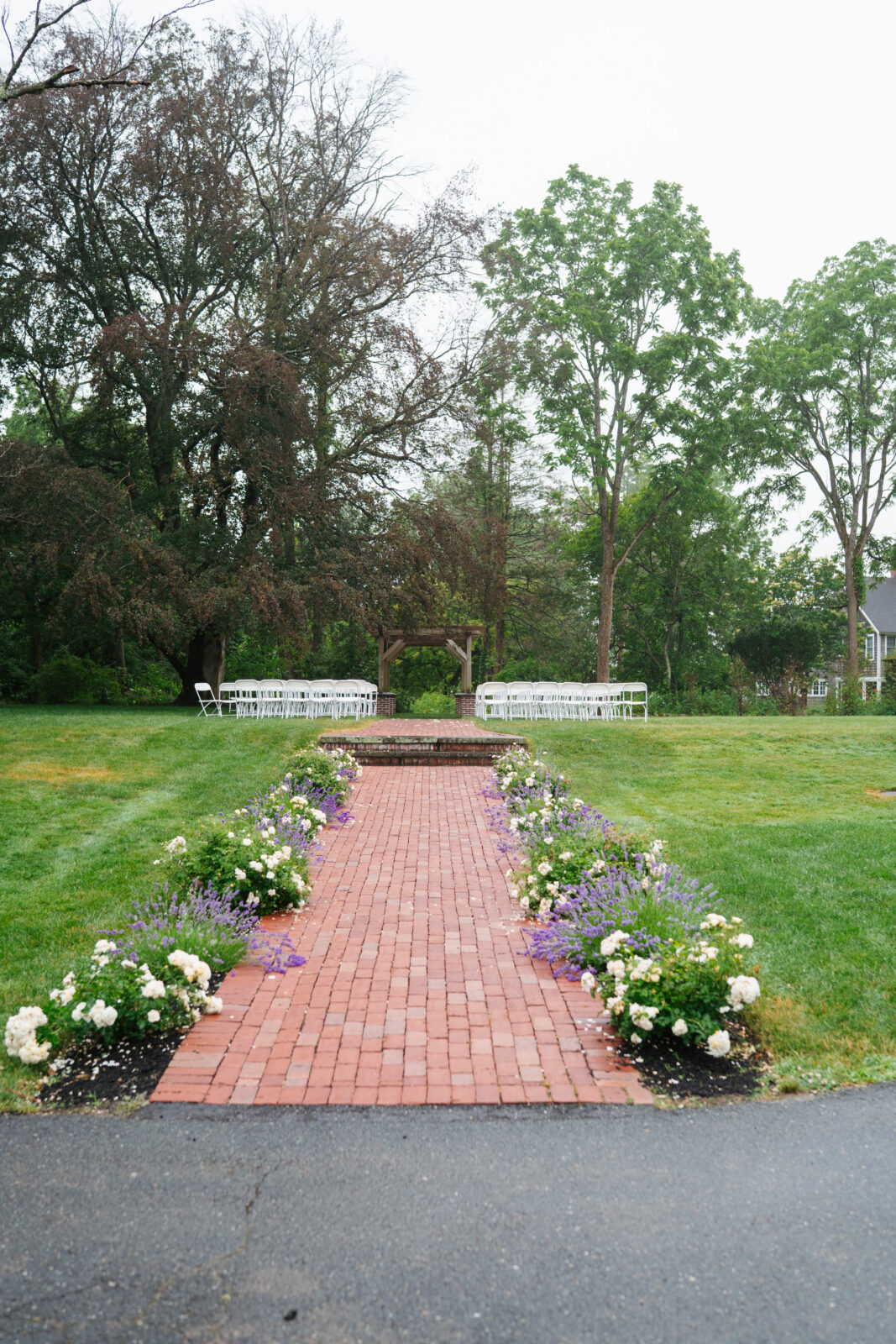 garden wedding ceremony surrounded by flowers in Massachusetts