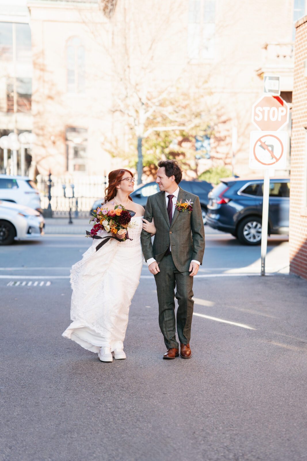 Newlyweds photographed at the famous red brick backdrop at Olio