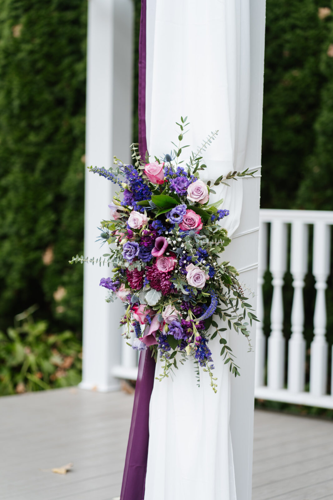 Garden ceremony aisle lined with floral arrangements at Saphire Estate
